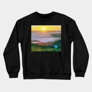 A dog watching the sunrise on Mam Tor, Derbyshire, UK Crewneck Sweatshirt